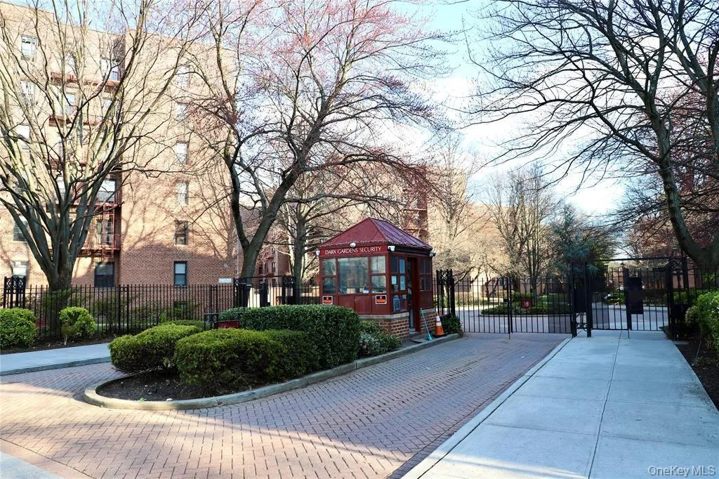 View of home's community with a gate View of home's community with a gate