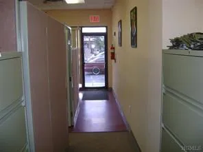 Hallway featuring baseboards Hallway featuring baseboards