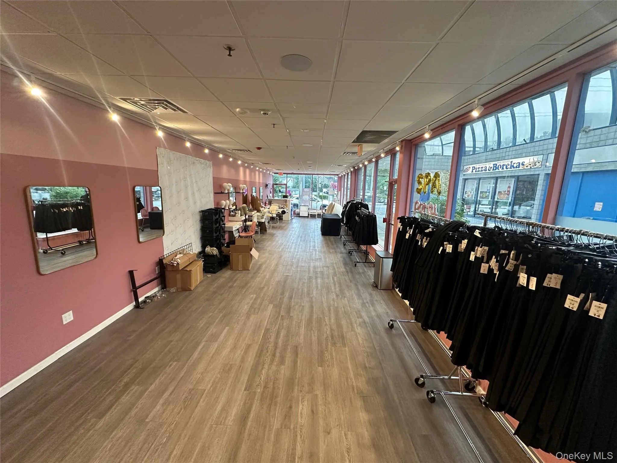 Exercise room featuring wood finished floors and a paneled ceiling Exercise room featuring wood finished floors and a paneled ceiling