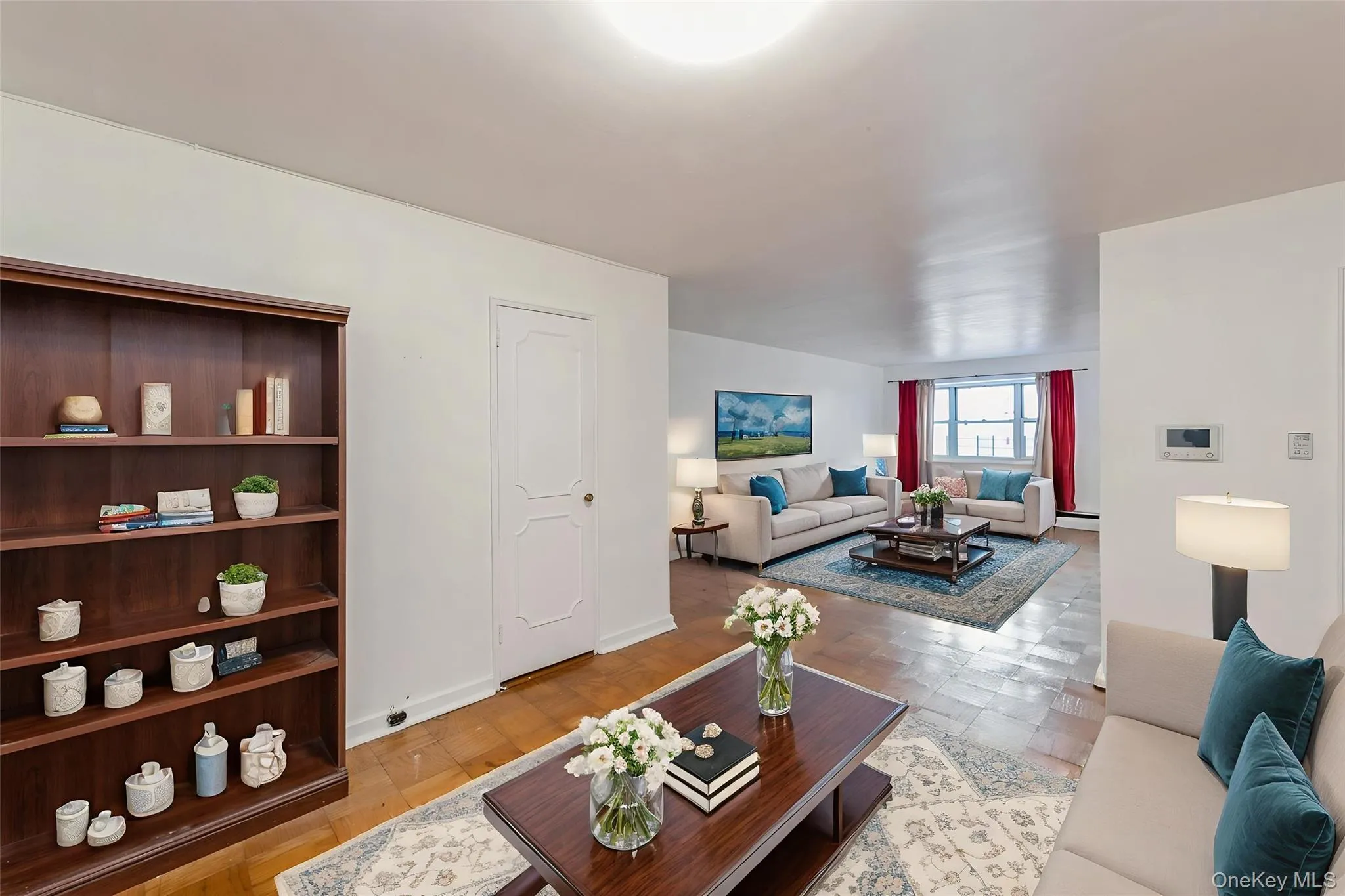 Living area featuring baseboards Living area featuring baseboards