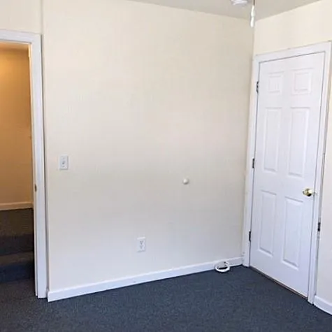 Spare room with dark colored carpet Spare room with dark colored carpet