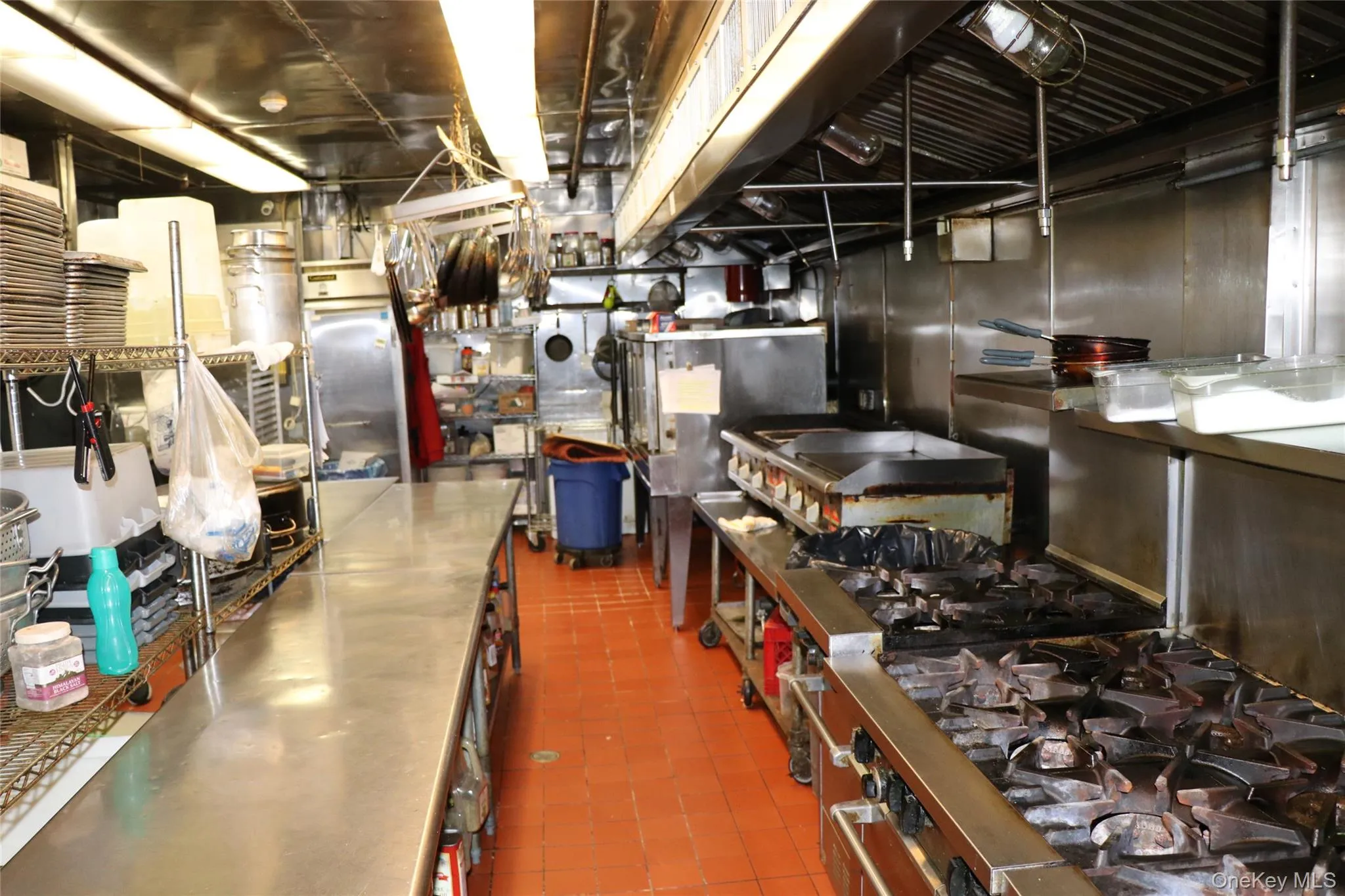 Kitchen featuring stainless steel counters and stainless steel gas stove Kitchen featuring stainless steel counters and stainless steel gas stove