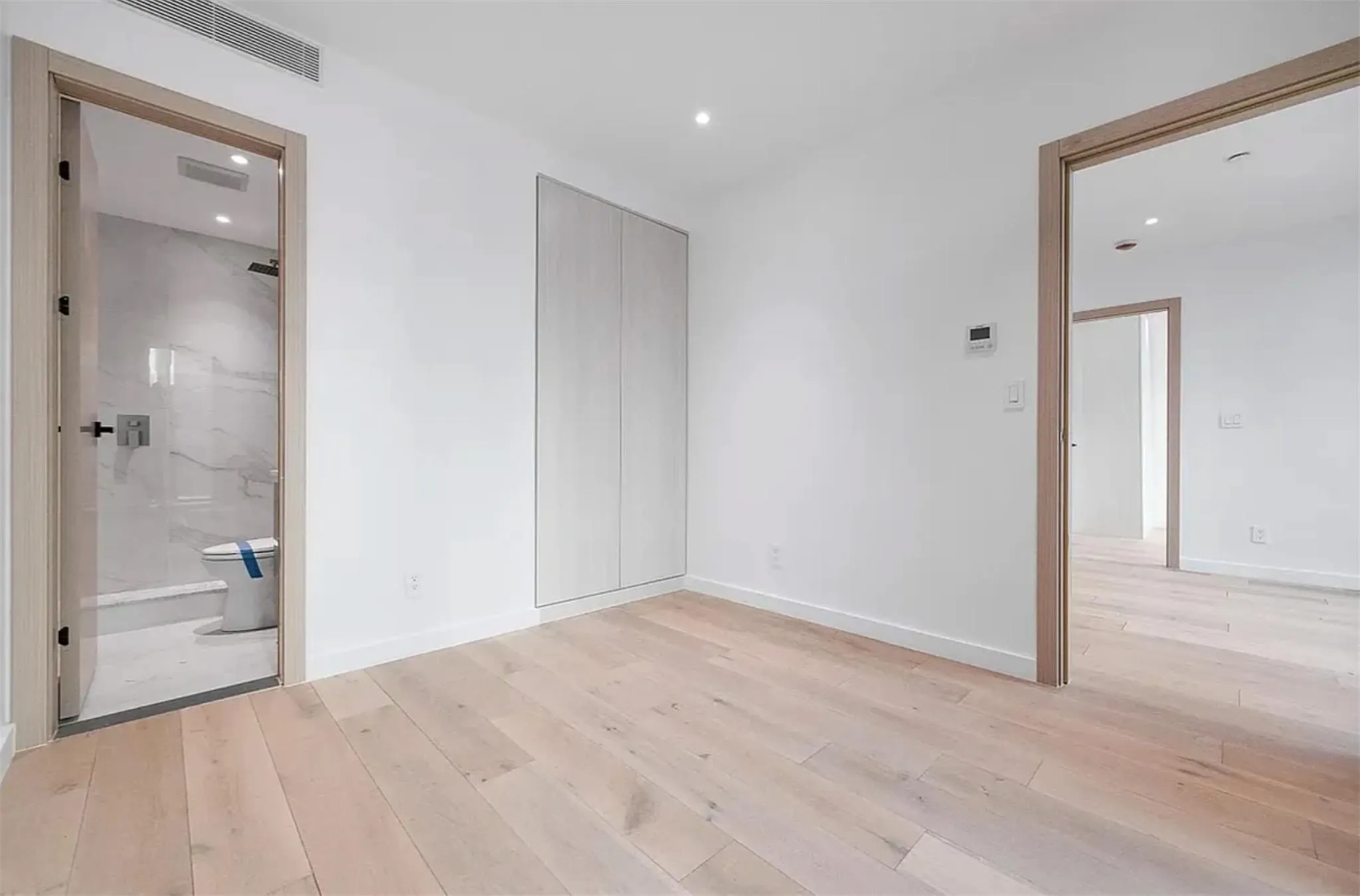 Unfurnished bedroom with light wood-style floors, recessed lighting, and a closet Unfurnished bedroom with light wood-style floors, recessed lighting, and a closet