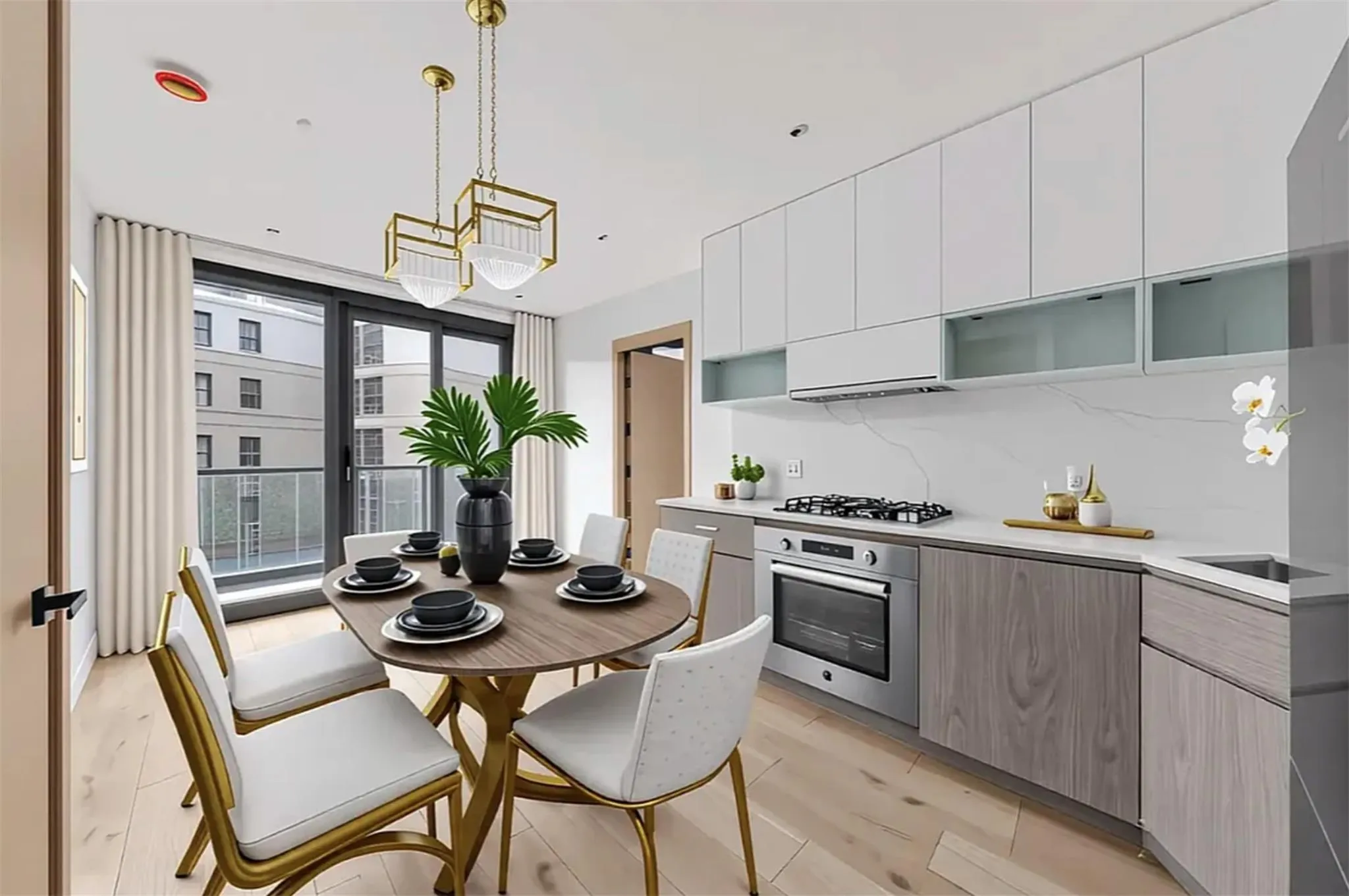 Kitchen featuring appliances with stainless steel finishes, modern cabinets, light countertops, and a chandelier Kitchen featuring appliances with stainless steel finishes, modern cabinets, light countertops, and a chandelier