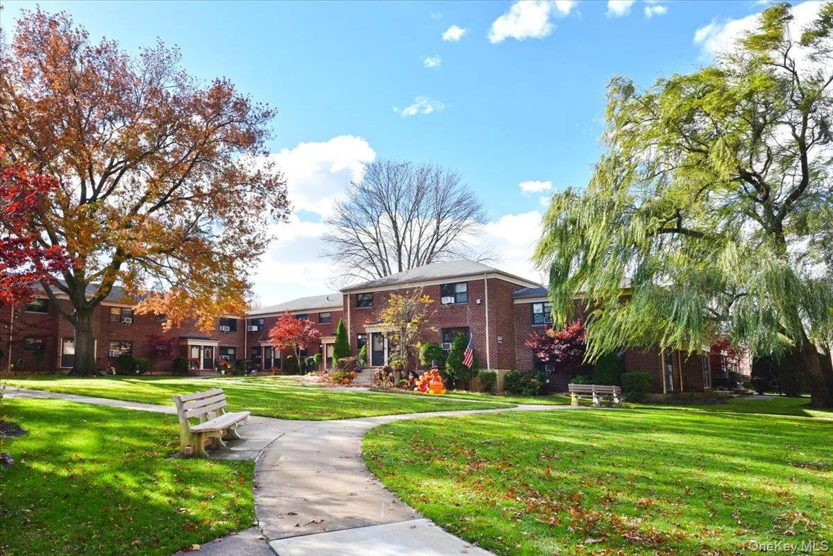View of property's community featuring a yard View of property's community featuring a yard