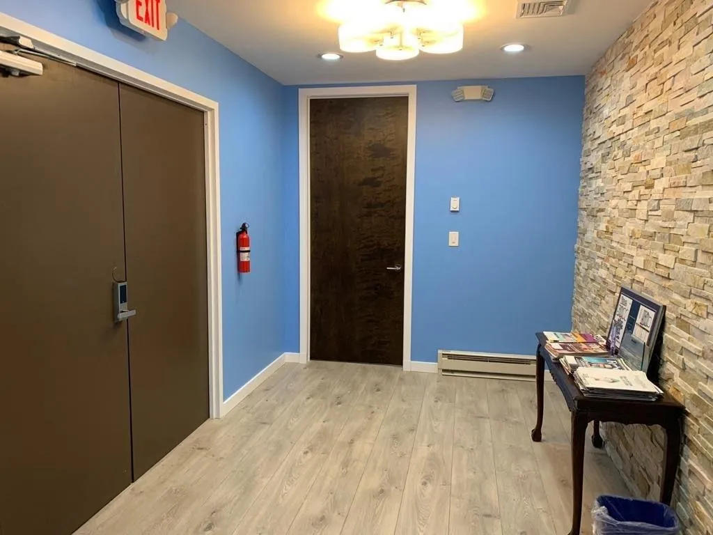 Entrance foyer featuring light wood-style flooring, a baseboard heating unit, and recessed lighting Entrance foyer featuring light wood-style flooring, a baseboard heating unit, and recessed lighting