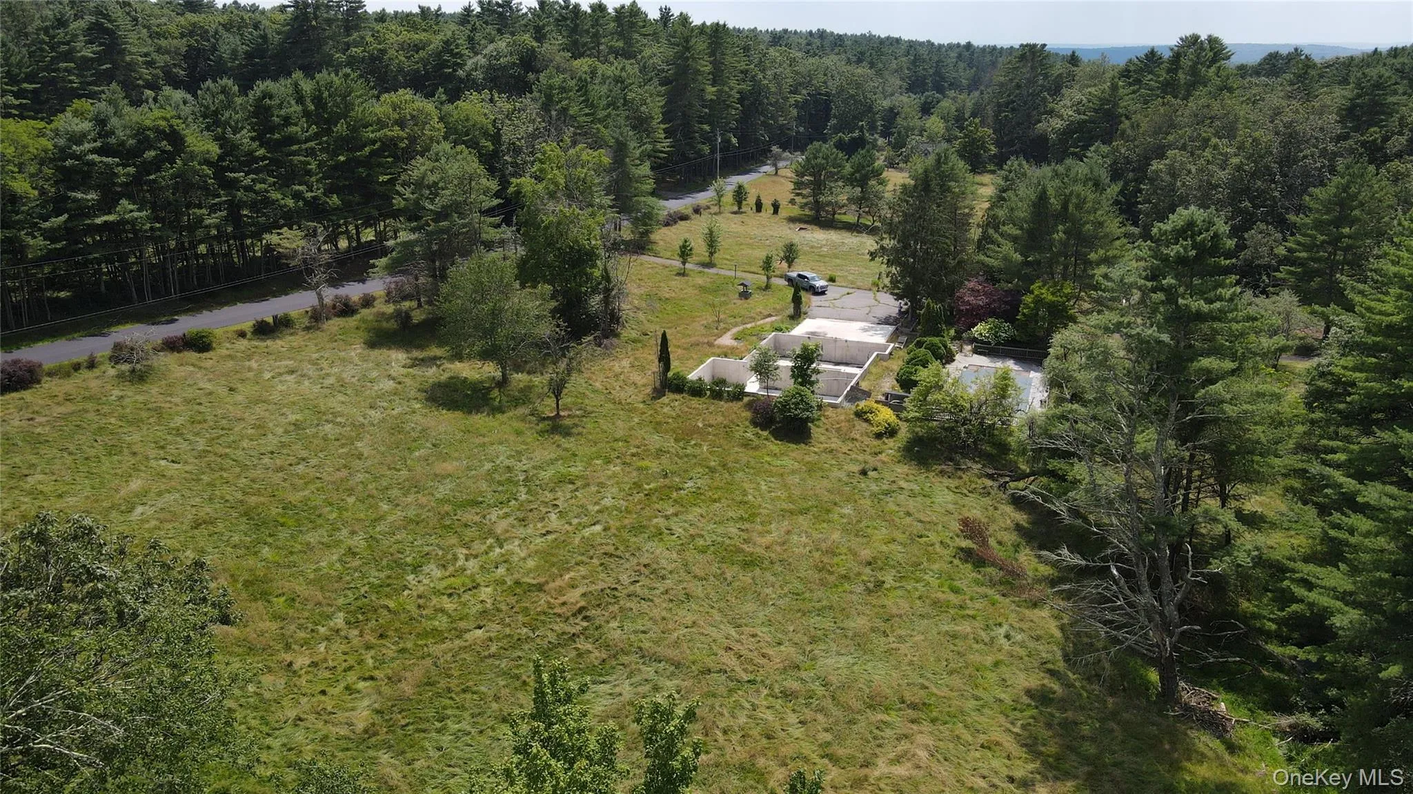 View from above of property with a forest View from above of property with a forest