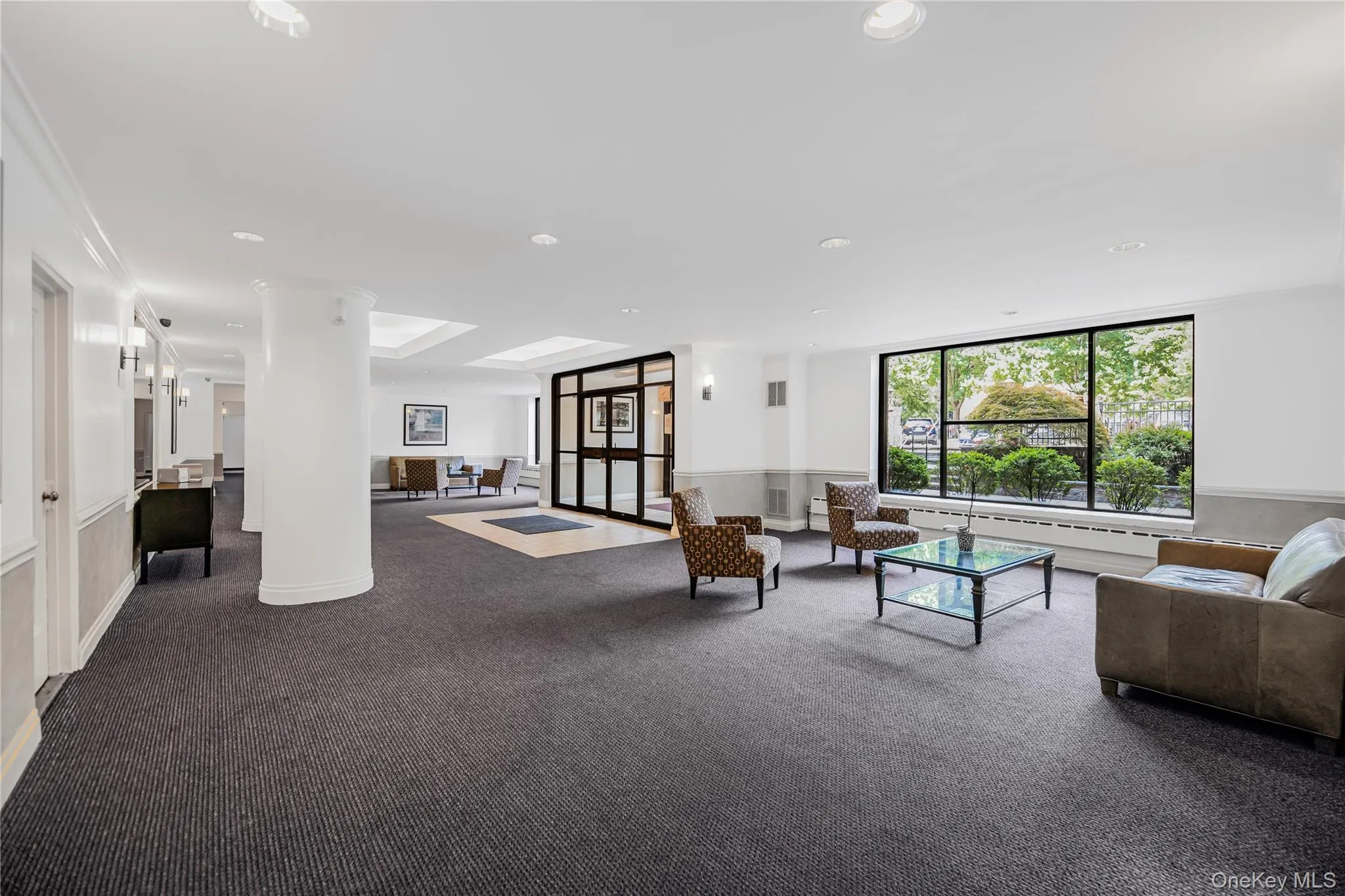 Building lobby with recessed lighting and wainscoting Building lobby with recessed lighting and wainscoting
