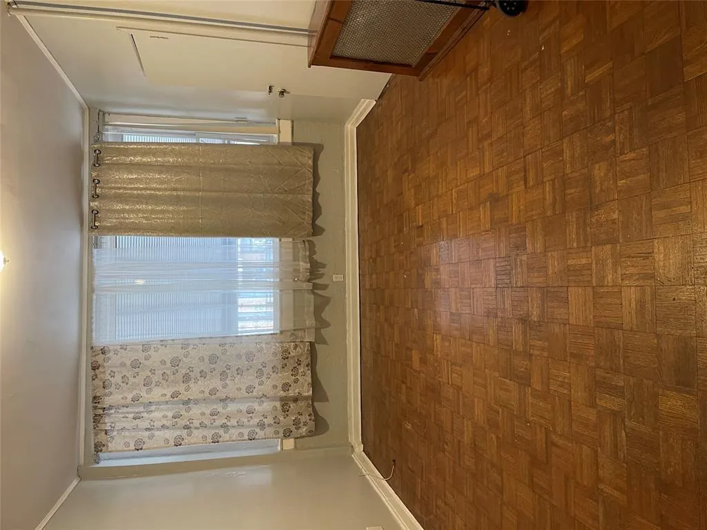 Empty room featuring ornamental molding and healthy amount of natural light Empty room featuring ornamental molding and healthy amount of natural light