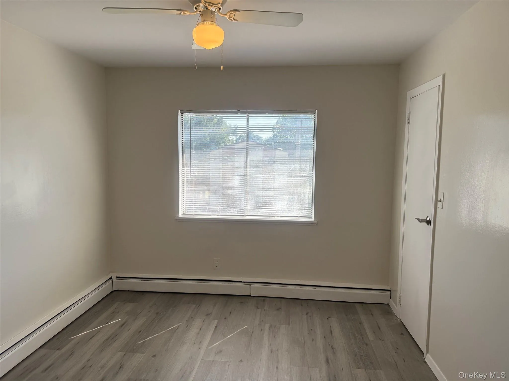 Dining area has light wood-type flooring, a baseboard radiator, ceiling fan, and large walk-in pantry. Dining area has light wood-type flooring, a baseboard radiator, ceiling fan, and large walk-in pantry.