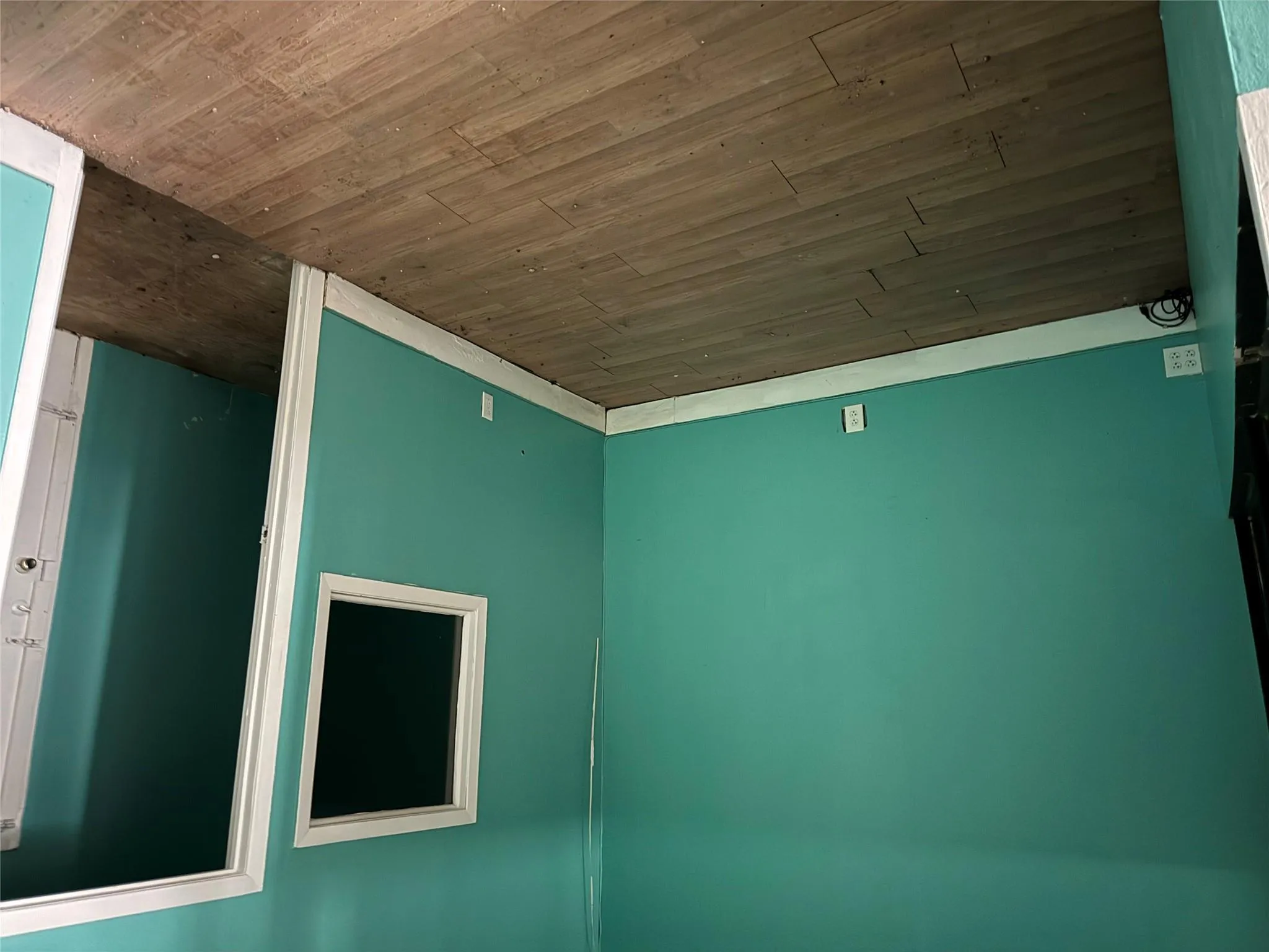 Unfurnished room featuring wood finished floors and baseboards Unfurnished room featuring wood finished floors and baseboards