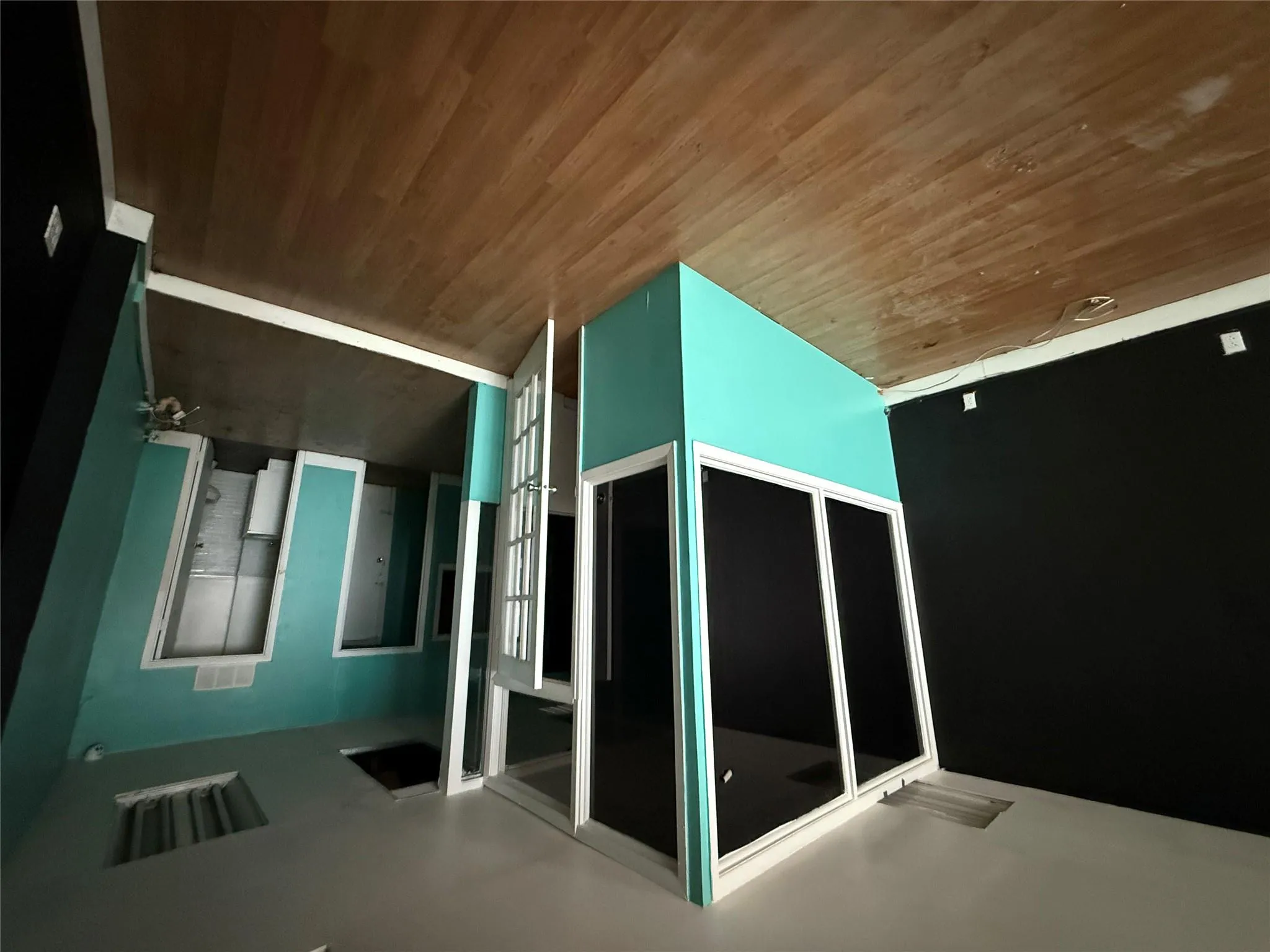 Empty room featuring wood finished floors and baseboards Empty room featuring wood finished floors and baseboards