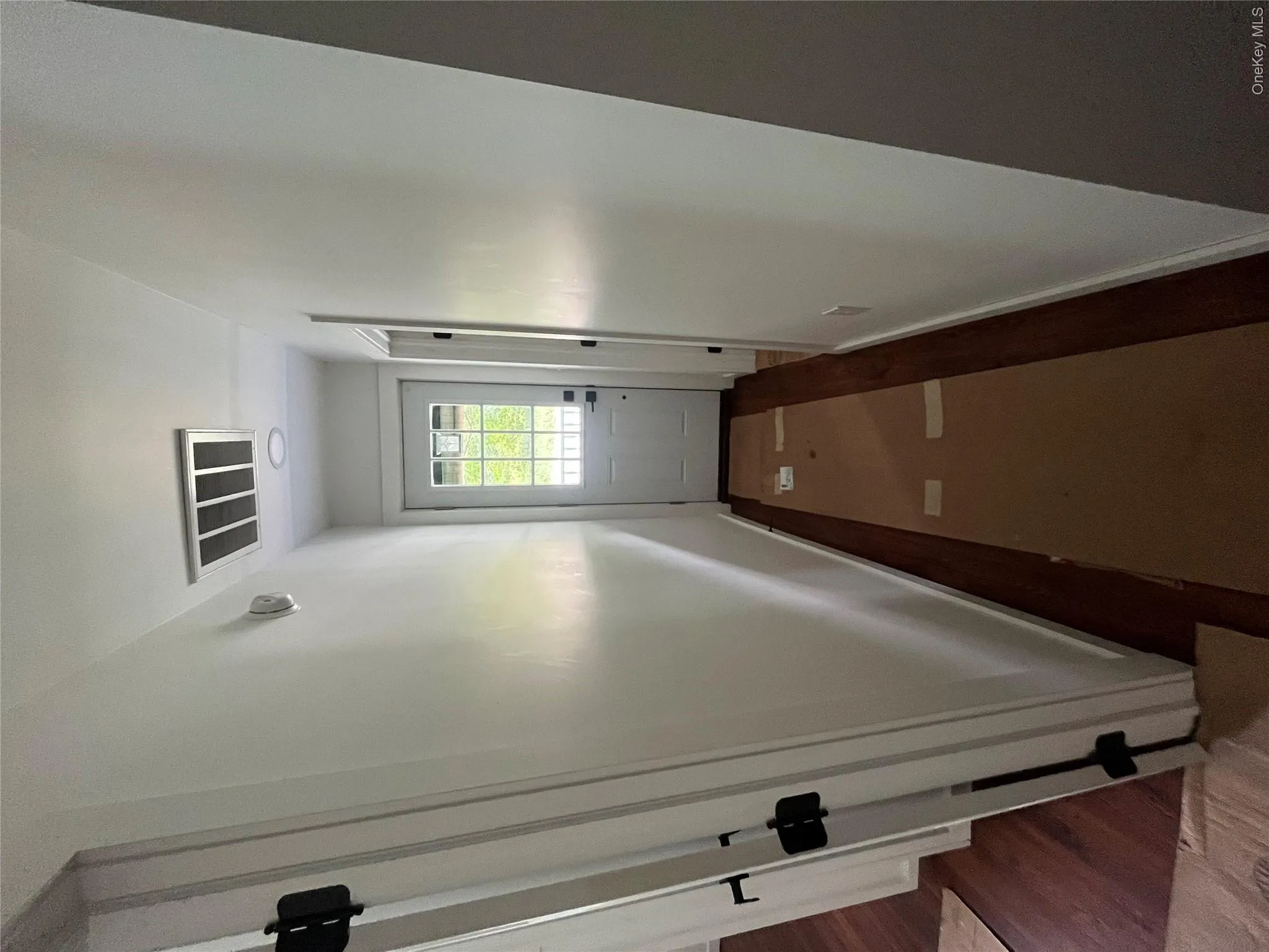 Hall featuring dark wood-style floors Hall featuring dark wood-style floors