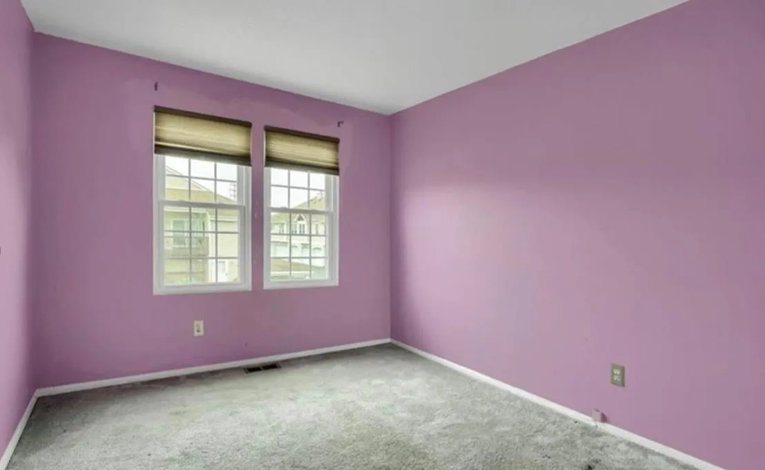 Empty room featuring carpet floors and baseboards Empty room featuring carpet floors and baseboards