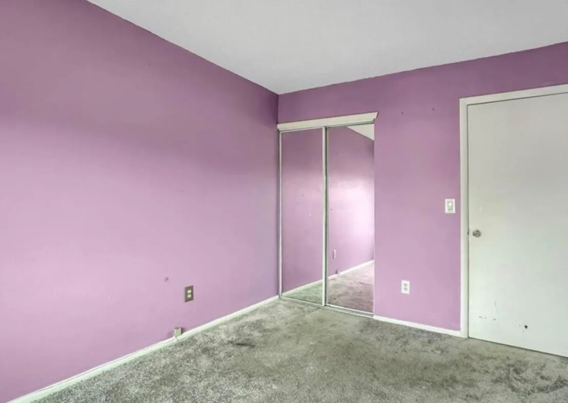 Unfurnished bedroom with carpet flooring and a closet Unfurnished bedroom with carpet flooring and a closet