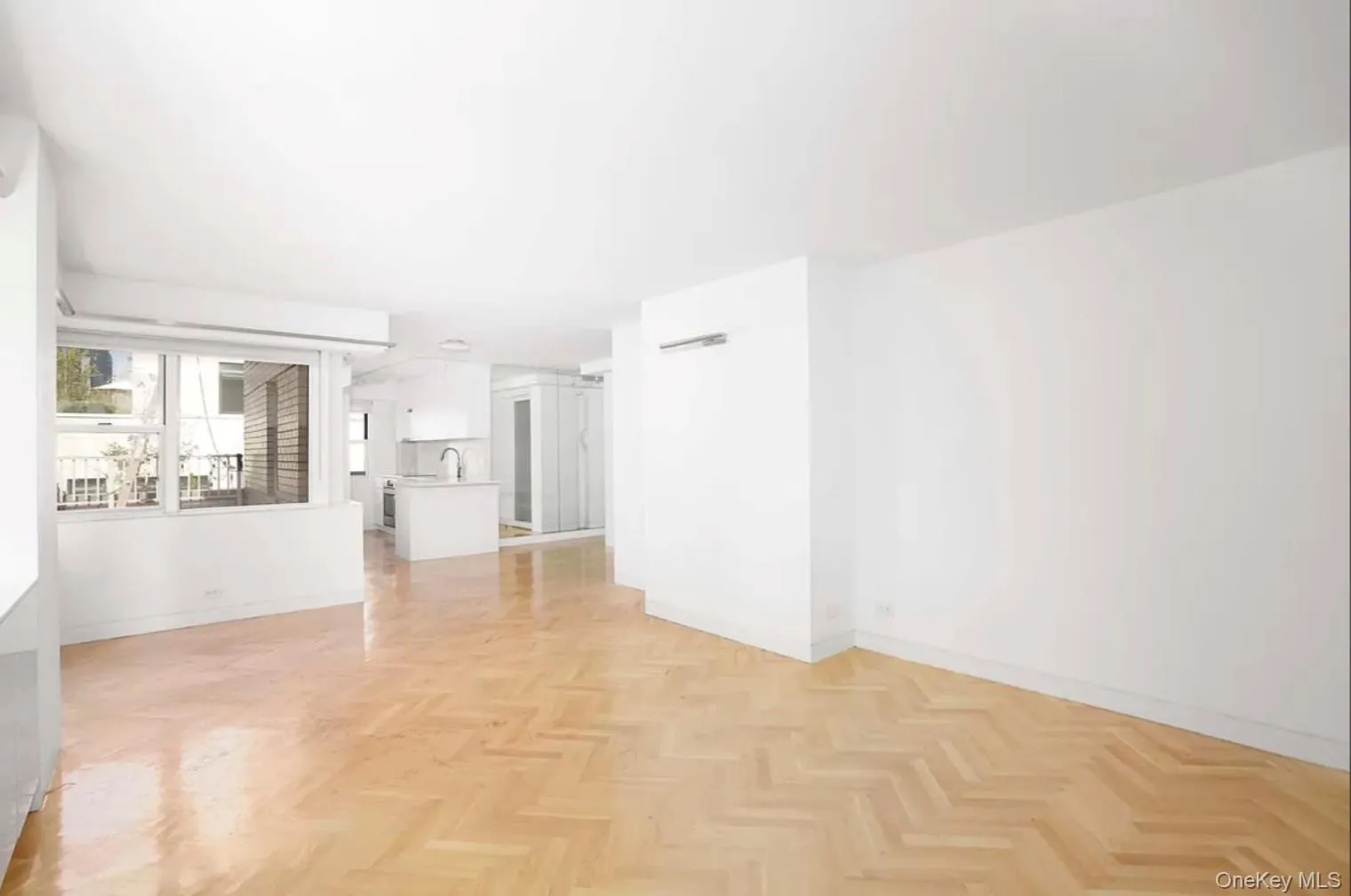 Unfurnished living room featuring baseboards Unfurnished living room featuring baseboards