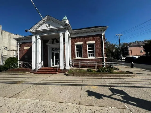 Greek revival inspired property with brick siding Greek revival inspired property with brick siding