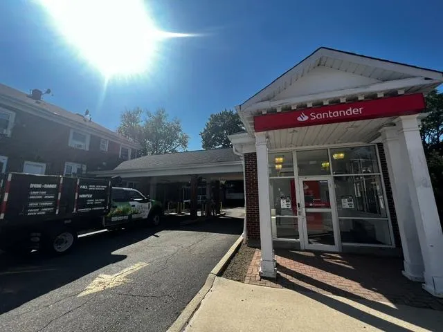 View of building exterior featuring a parking lot View of building exterior featuring a parking lot