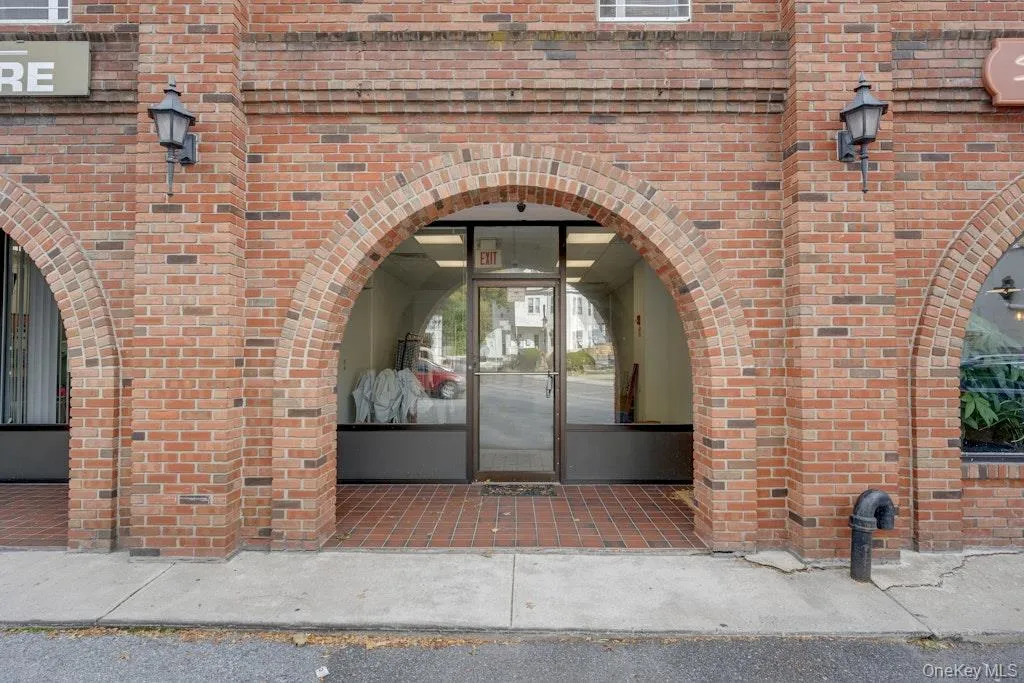 Property entrance with brick siding Property entrance with brick siding
