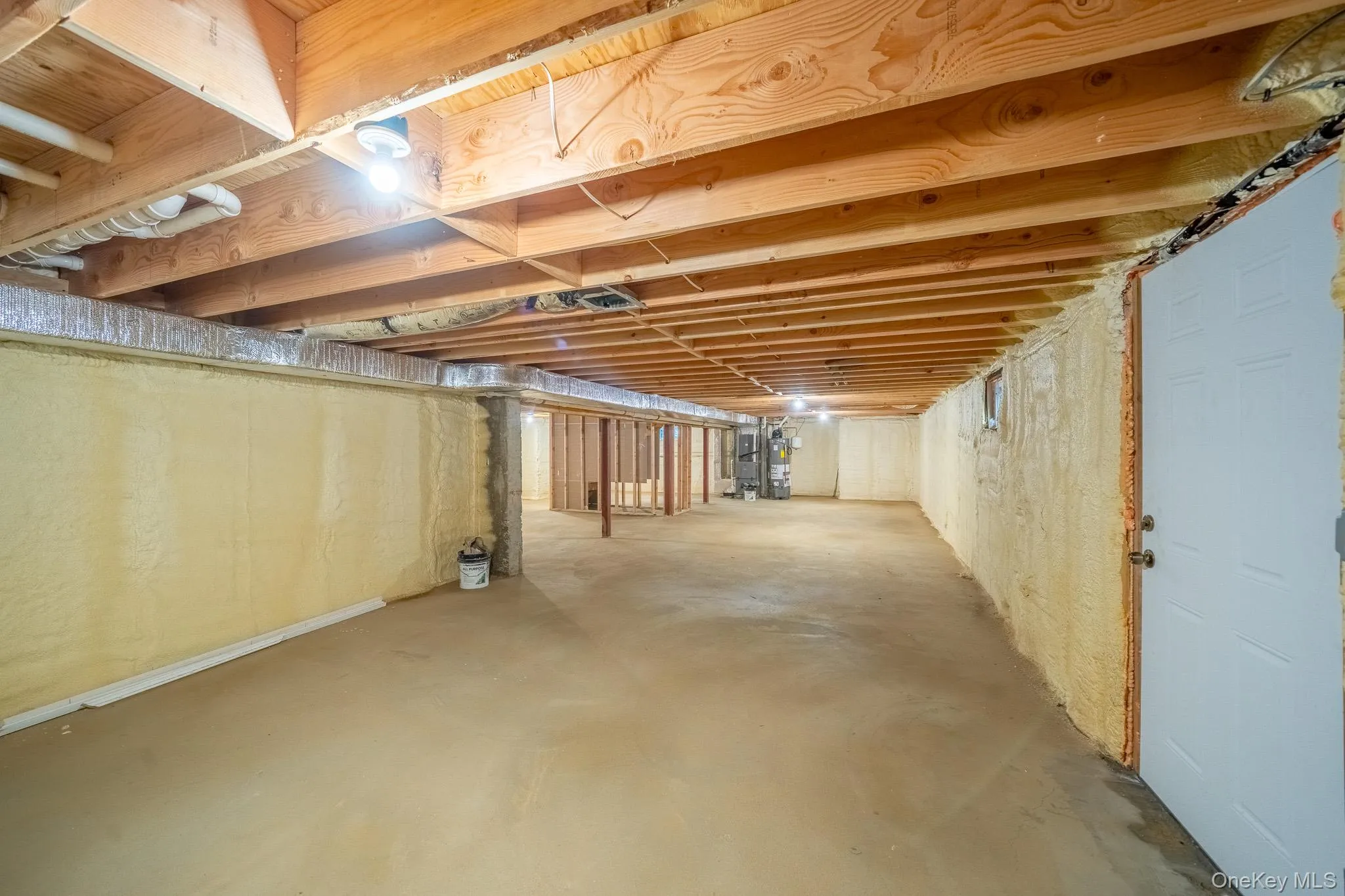 Unfinished below grade area featuring gas water heater Unfinished below grade area featuring gas water heater