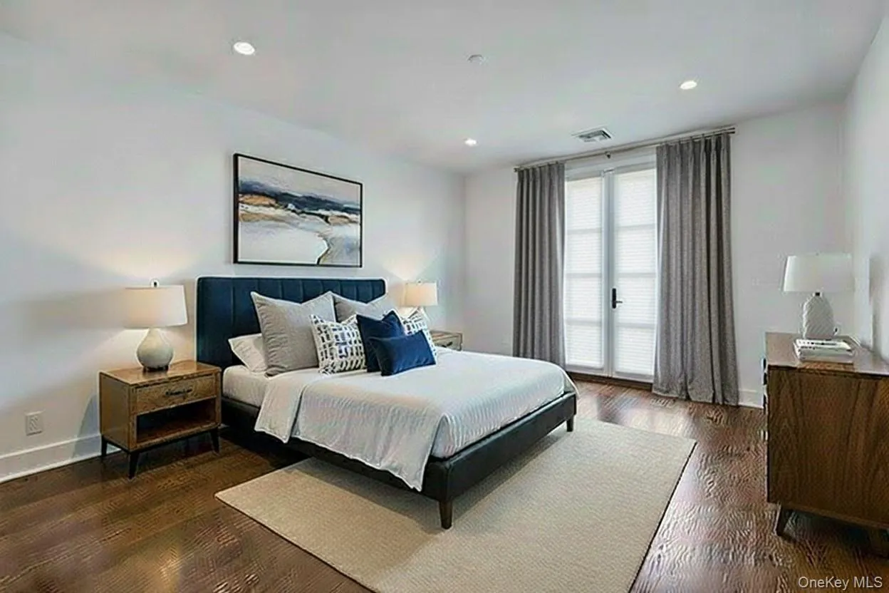 Primary Bedroom w/Walk In Closet & Door To Balcony - Virtually staged Primary Bedroom w/Walk In Closet & Door To Balcony - Virtually staged