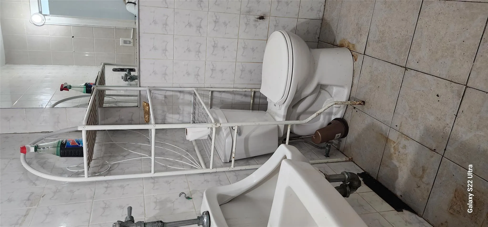 Half bath with tile walls and tile patterned floors Half bath with tile walls and tile patterned floors