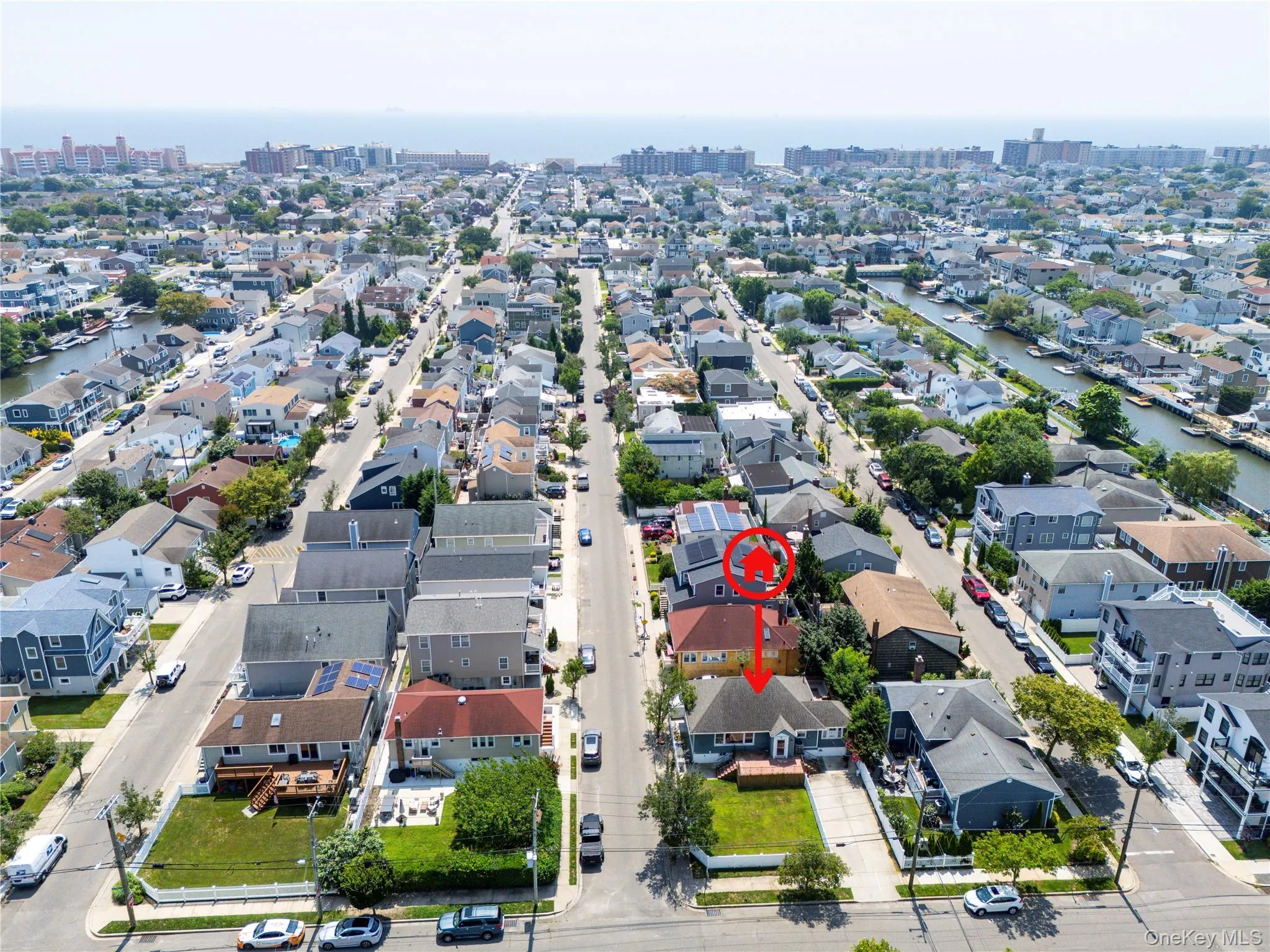 View of urban area with a nearby body of water and nearby suburban area View of urban area with a nearby body of water and nearby suburban area