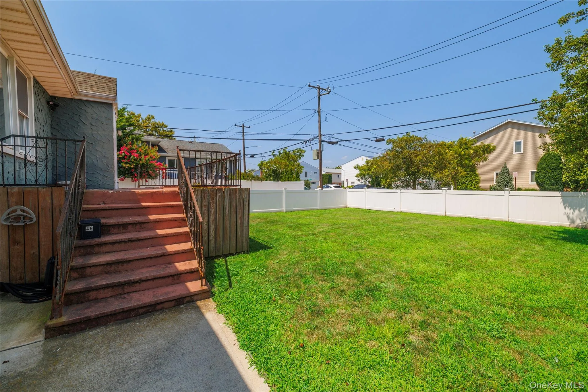 Fenced backyard with stairway Fenced backyard with stairway