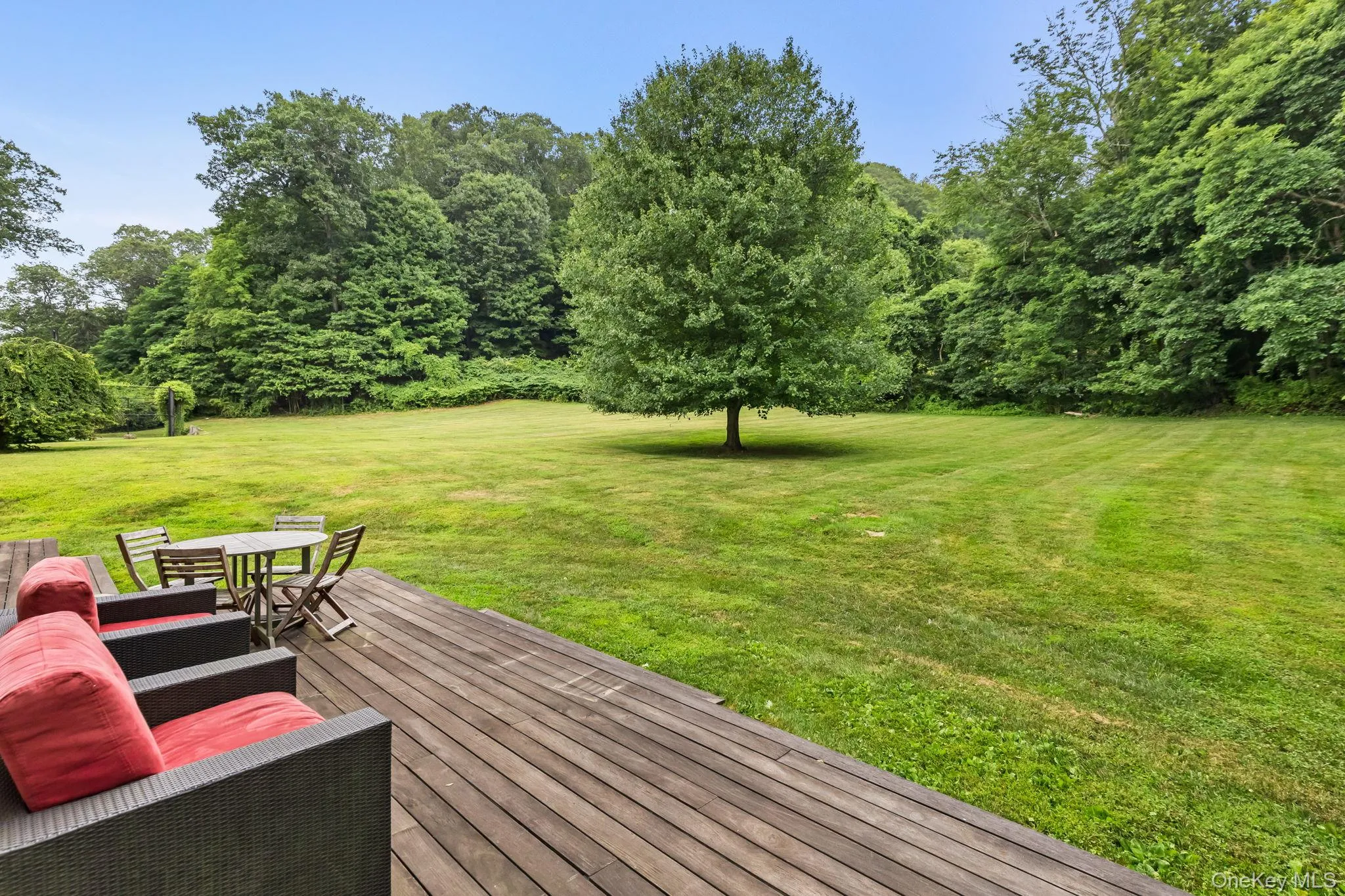 Relax outdoors on deck from great room Relax outdoors on deck from great room