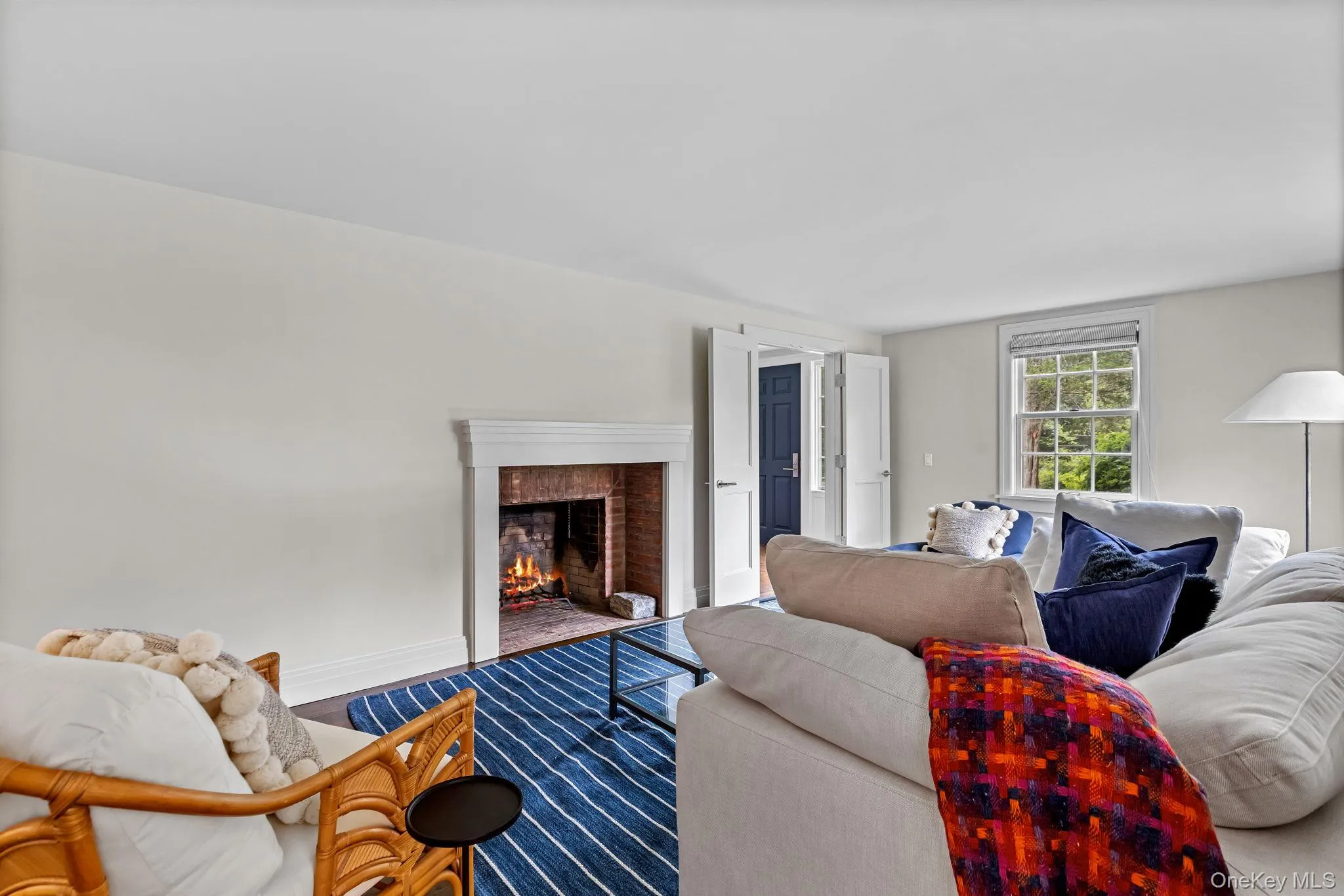 Flexible space that could be used as bedroom, living room, or home office featuring wood floors and wood burning fireplace Flexible space that could be used as bedroom, living room, or home office featuring wood floors and wood burning fireplace