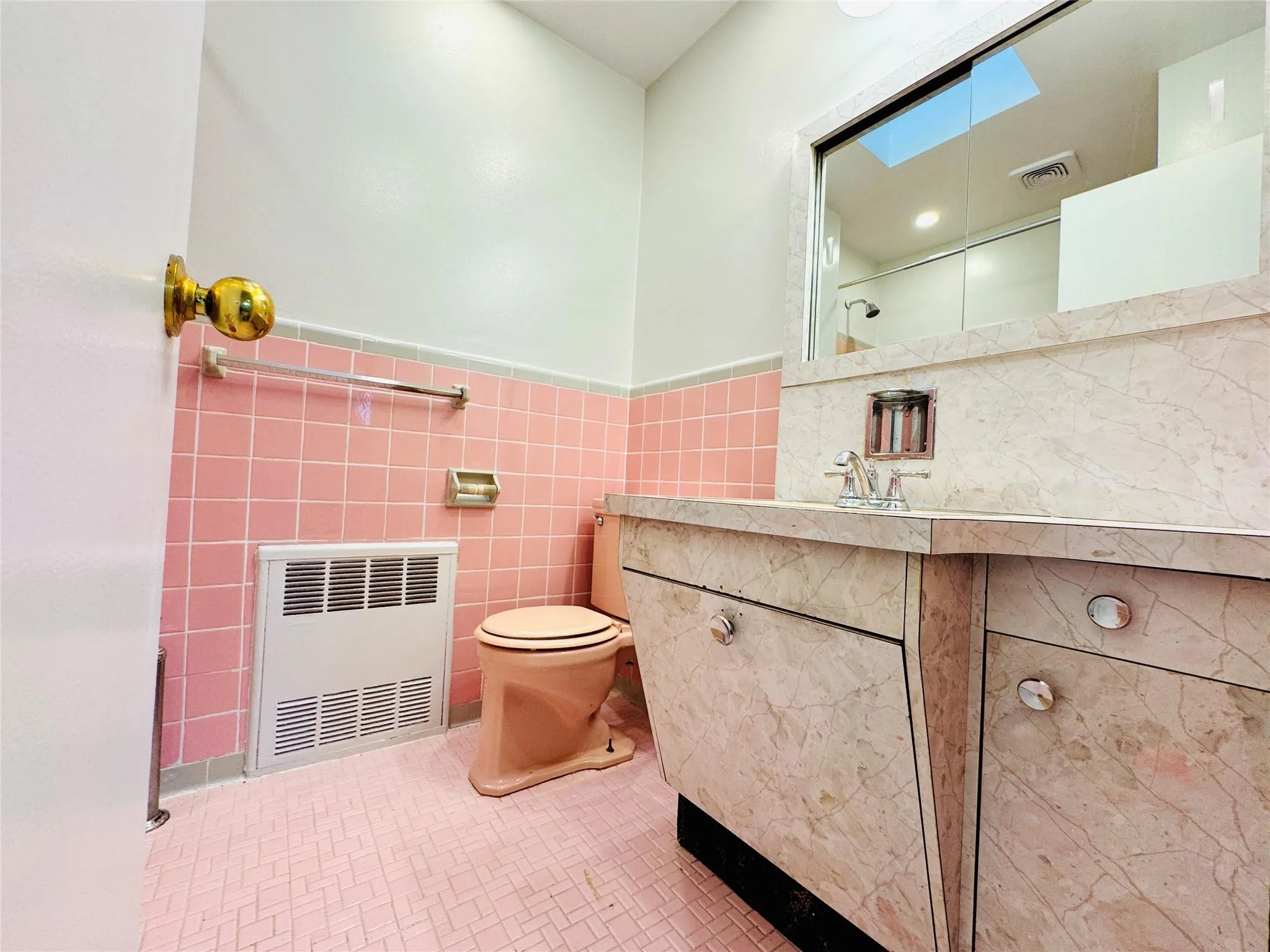 Bathroom featuring vanity, tile walls, and a wainscoted wall Bathroom featuring vanity, tile walls, and a wainscoted wall