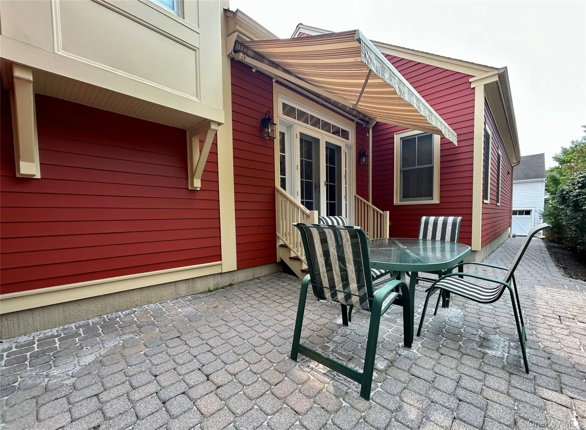 Step down from the Dining Room to enjoy this private paver patio with a remote controlled awning Step down from the Dining Room to enjoy this private paver patio with a remote controlled awning
