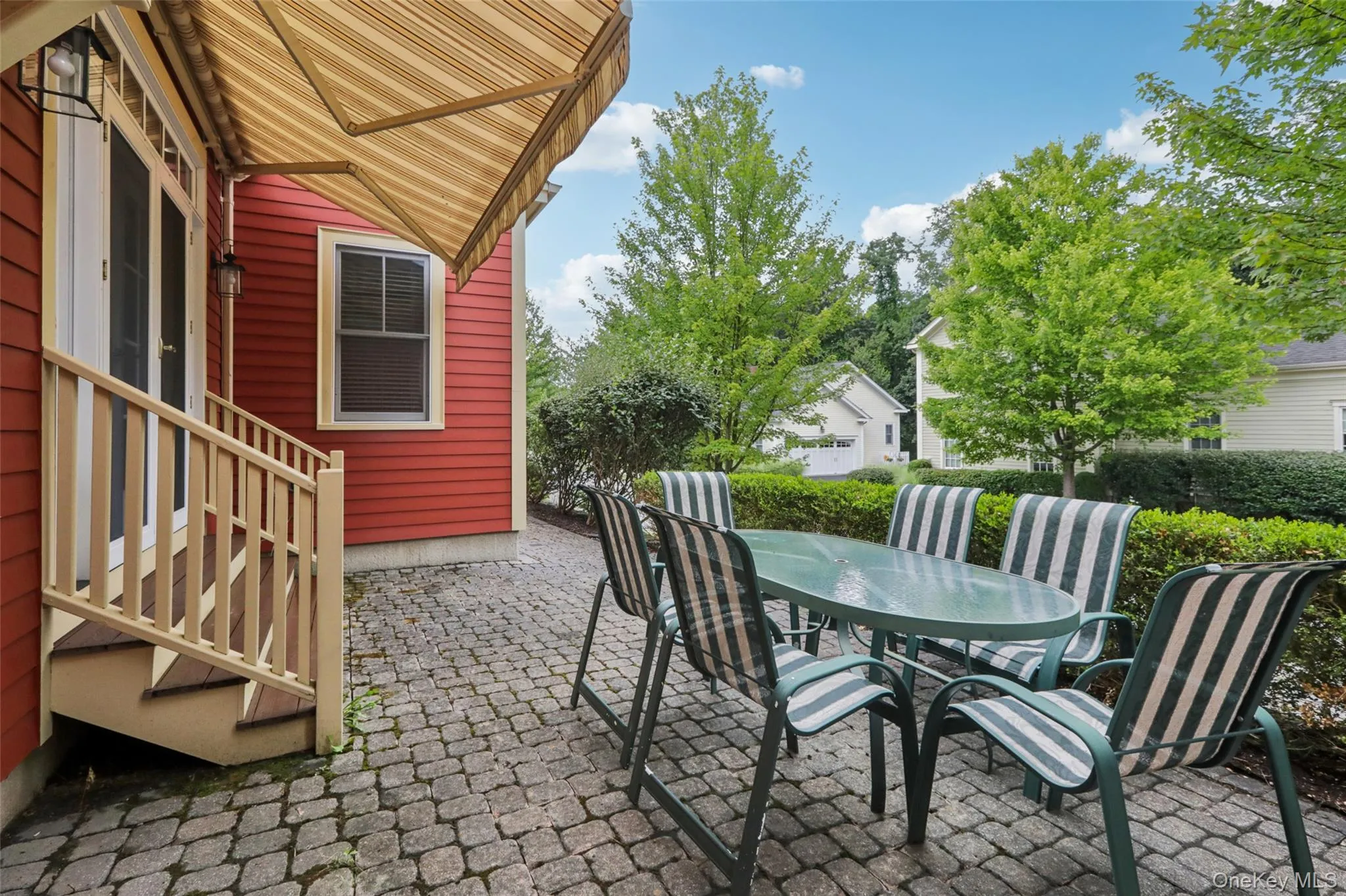 Step down from the Dining Room to enjoy this private paver patio with a remote controlled awning Step down from the Dining Room to enjoy this private paver patio with a remote controlled awning