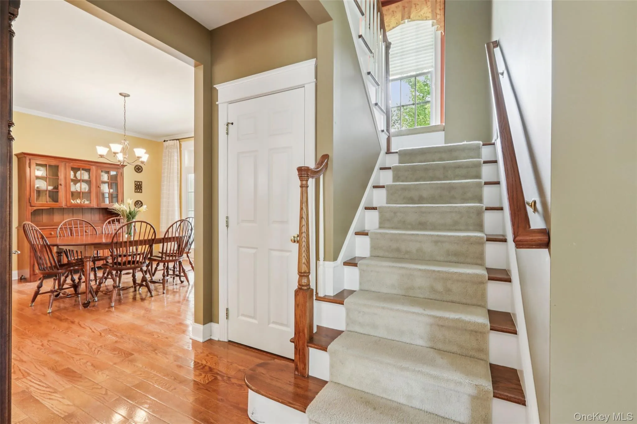 Staircase has a charming window seat halfway up Staircase has a charming window seat halfway up