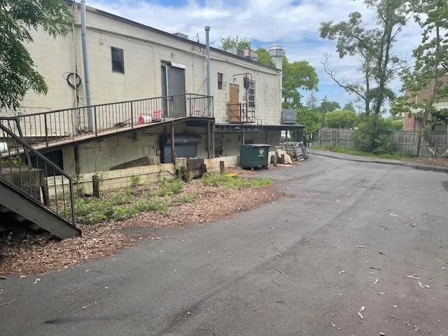 Back of property featuring stairs Back of property featuring stairs