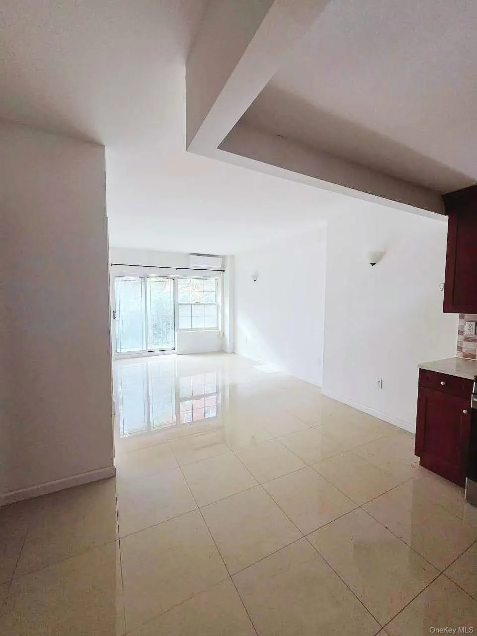 Unfurnished room featuring baseboards and light tile patterned flooring Unfurnished room featuring baseboards and light tile patterned flooring