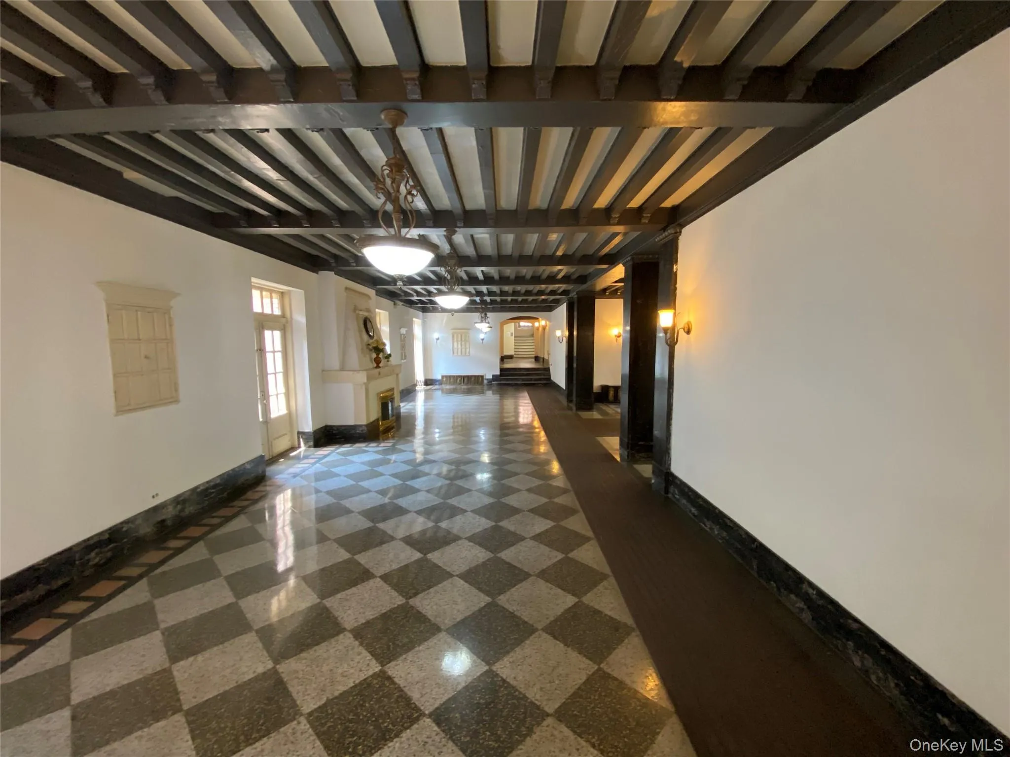 Hallway featuring baseboards Hallway featuring baseboards