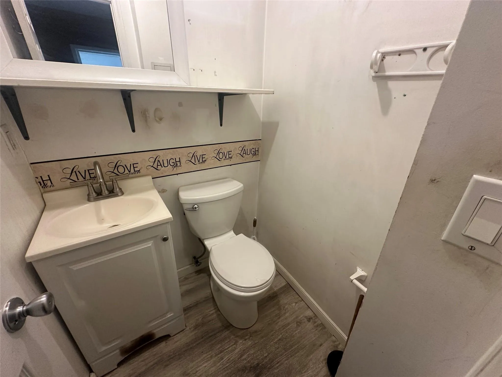 Bathroom with wood finished floors and vanity Bathroom with wood finished floors and vanity