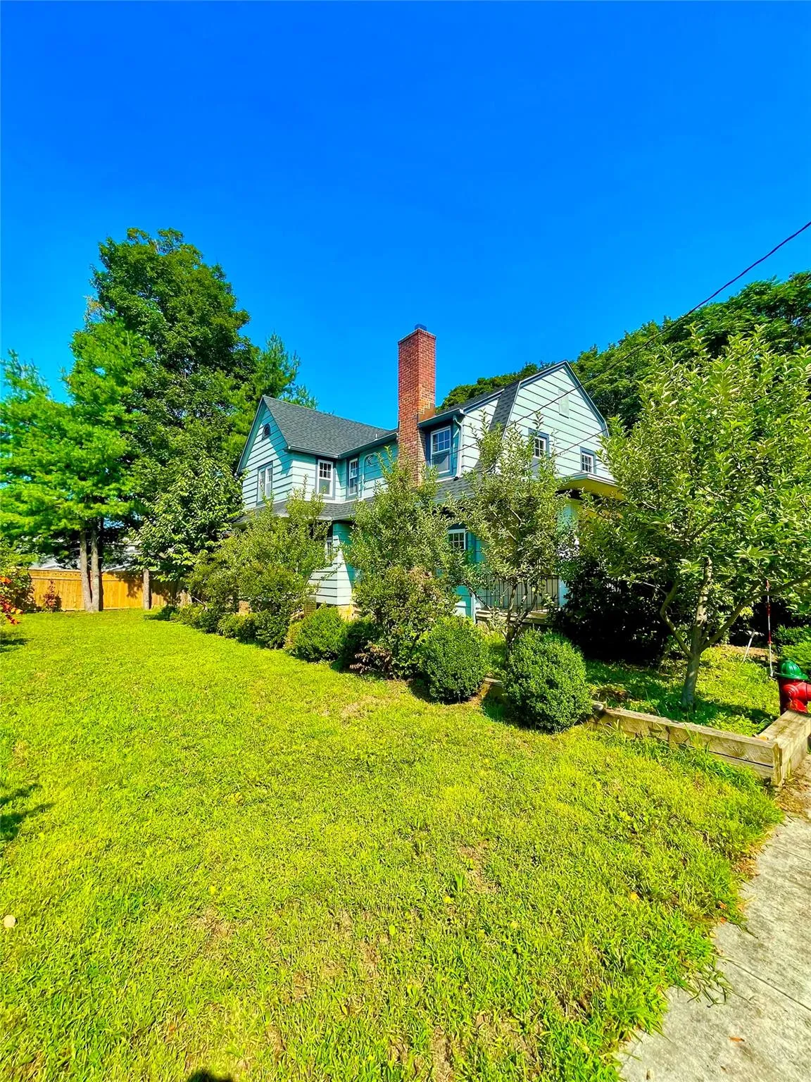 View of property exterior featuring a chimney View of property exterior featuring a chimney