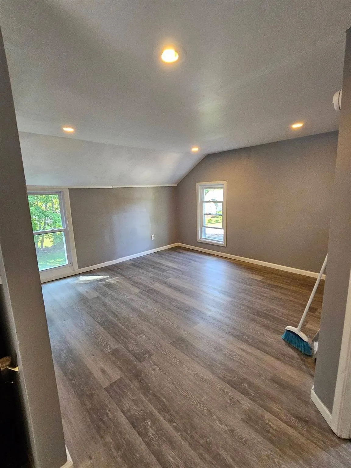 Bonus room with vaulted ceiling, healthy amount of natural light, wood finished floors, recessed lighting, and a textured ceiling Bonus room with vaulted ceiling, healthy amount of natural light, wood finished floors, recessed lighting, and a textured ceiling