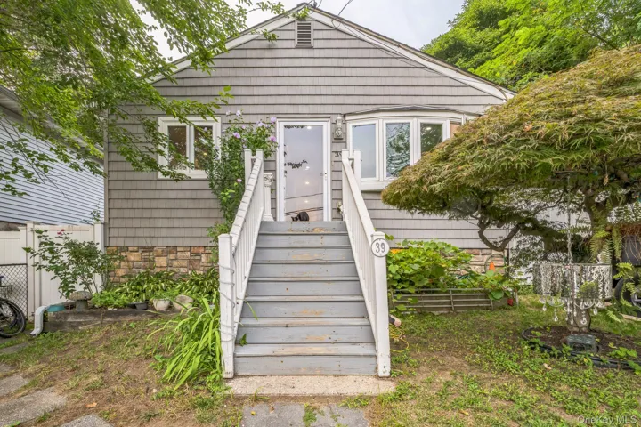 View of exterior entry with stone siding