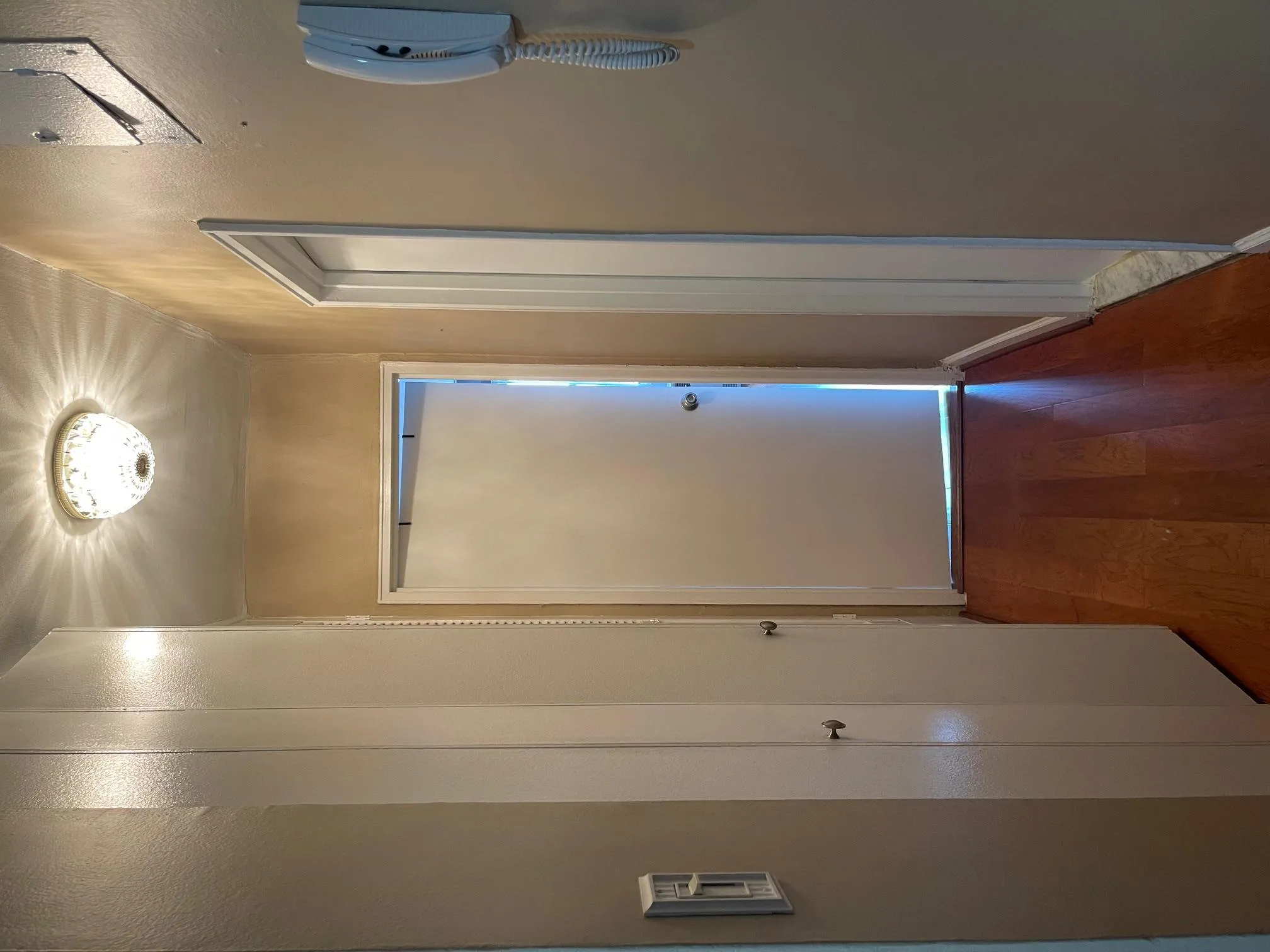 Hall with wood finished floors and baseboards Hall with wood finished floors and baseboards