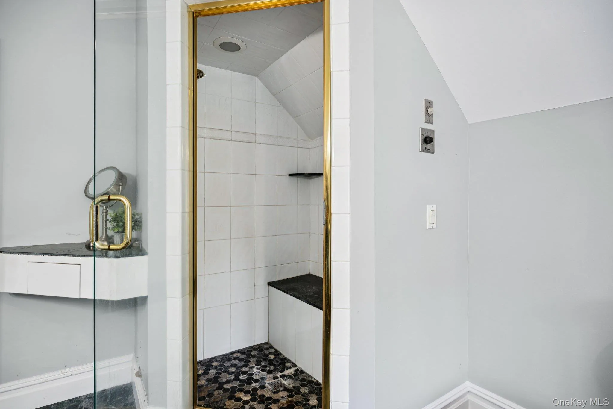 The primary bath offers a true spa retreat, complete with a whirlpool jetted tub, soft recessed lighting, double vanity, and an e-steam shower designed for ultimate relaxation. The primary bath offers a true spa retreat, complete with a whirlpool jetted tub, soft recessed lighting, double vanity, and an e-steam shower designed for ultimate relaxation.