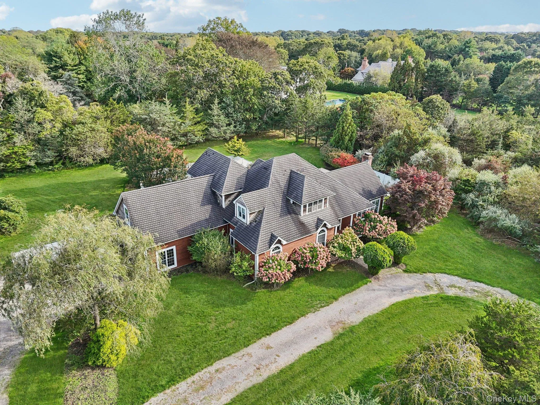 A stunning aerial view showcasing the property’s impressive front elevation and architectural presence. A stunning aerial view showcasing the property’s impressive front elevation and architectural presence.