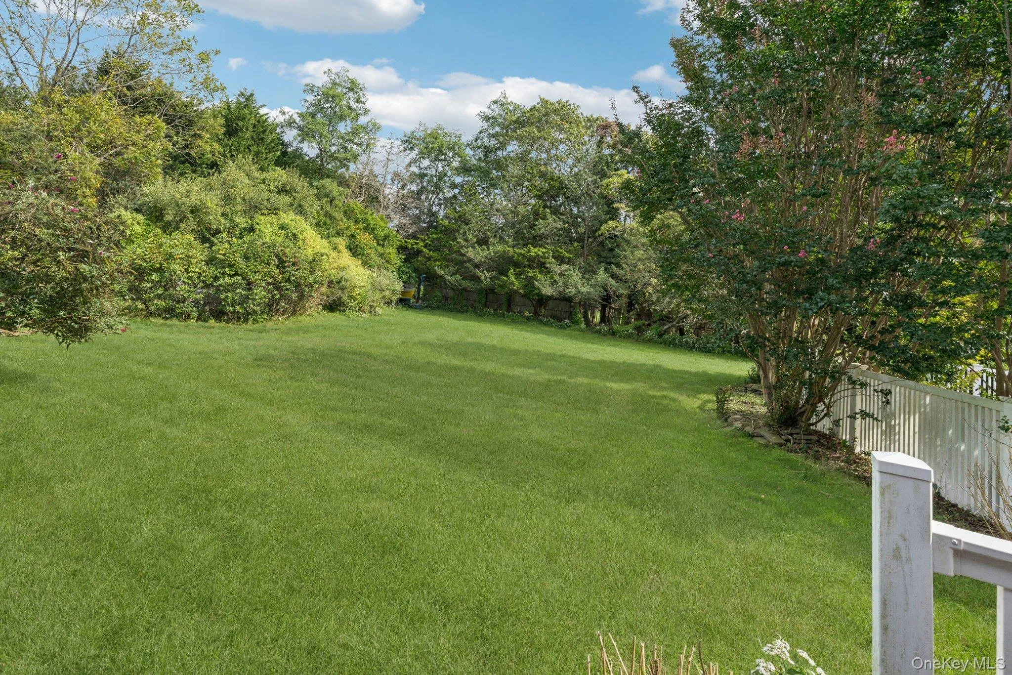 Rear view of the home featuring a fenced backyard. Rear view of the home featuring a fenced backyard.