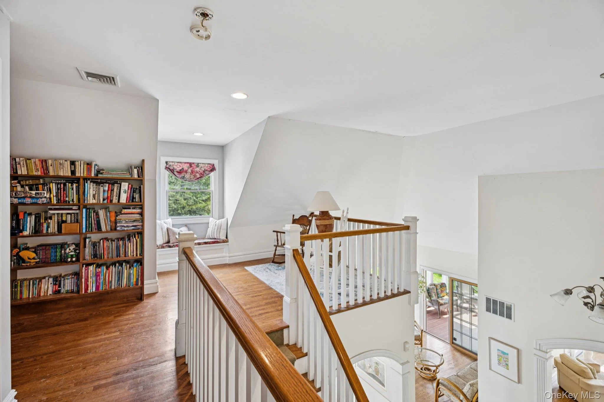 A beautifully crafted built-in library on the second level, designed to complement the home’s sophistication and charm. A beautifully crafted built-in library on the second level, designed to complement the home’s sophistication and charm.