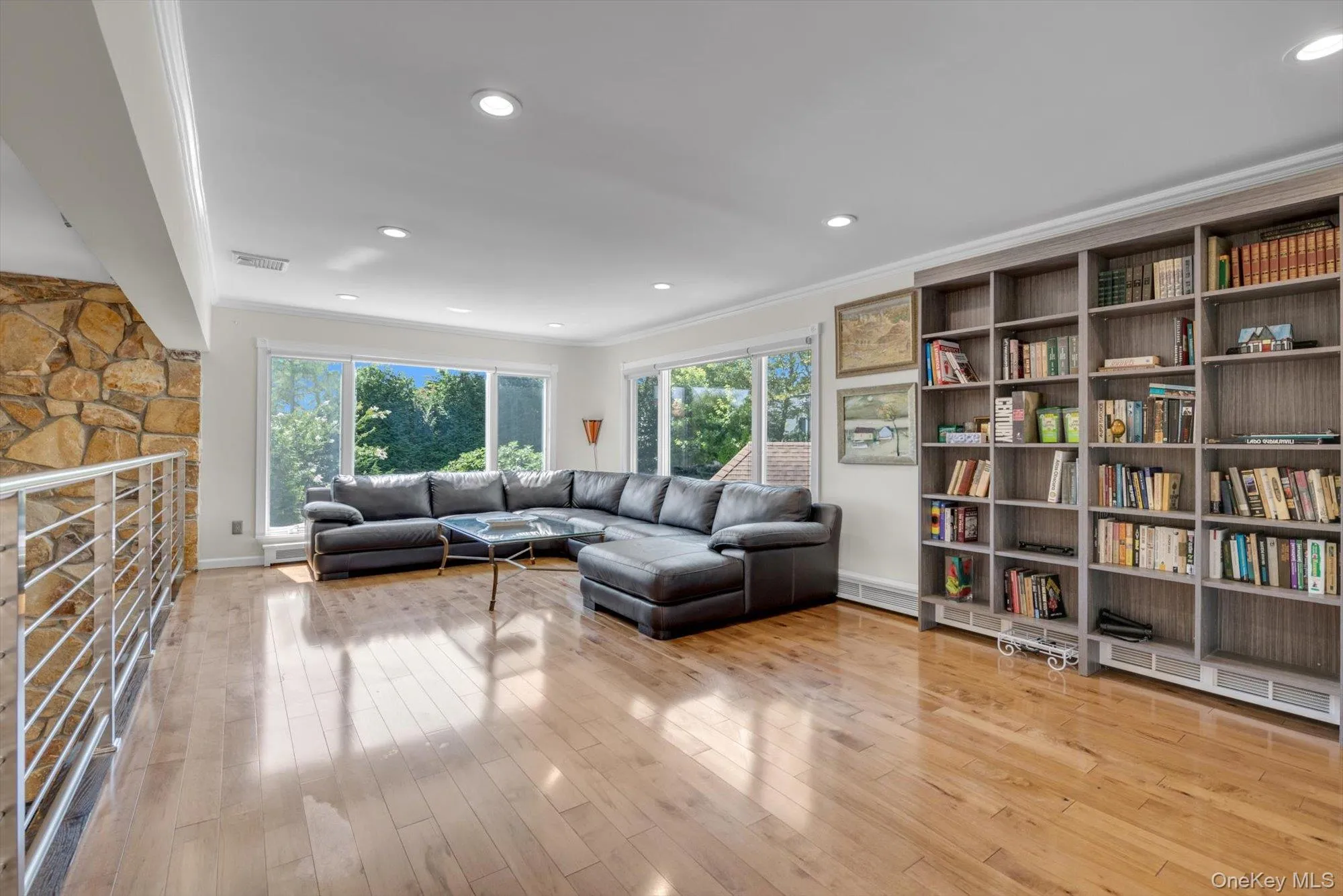 Upper Level Den Overlooking Living room featuring crown molding, plenty of natural light, wood flooring, and recessed lighting Upper Level Den Overlooking Living room featuring crown molding, plenty of natural light, wood flooring, and recessed lighting