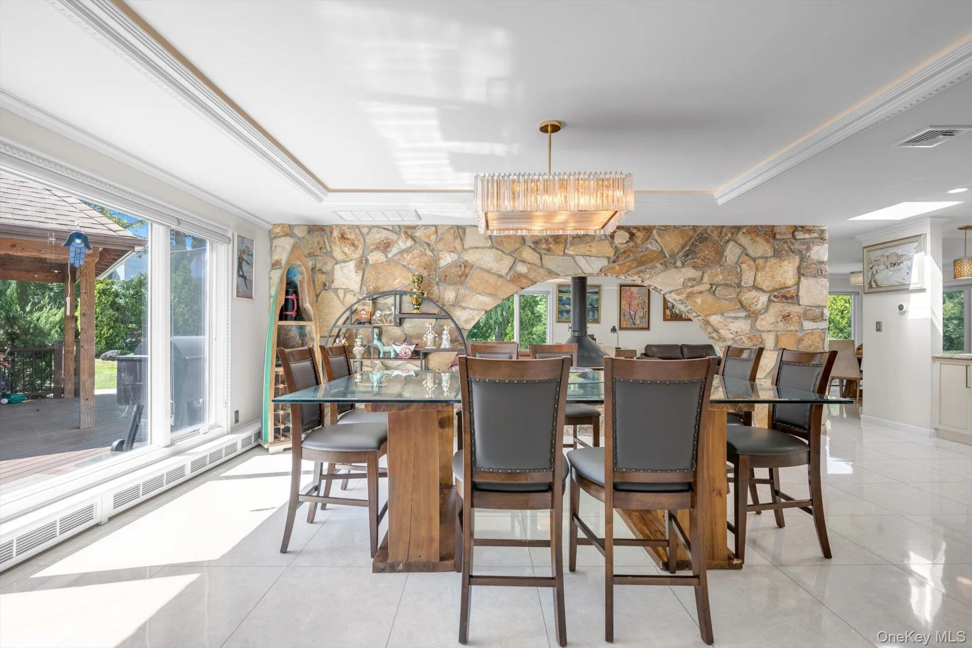Dining Room with a raised ceiling, plenty of natural light, and ornamental molding Dining Room with a raised ceiling, plenty of natural light, and ornamental molding