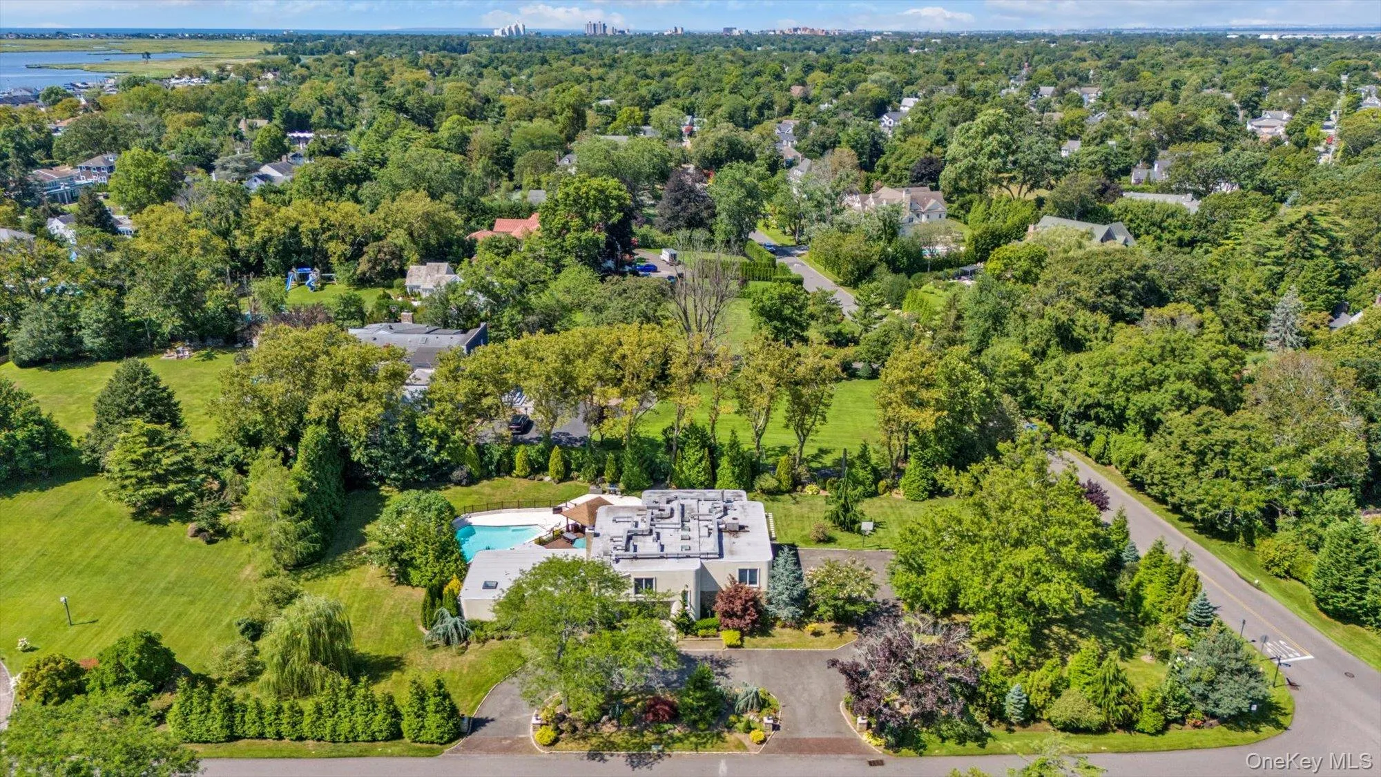 Aerial overview of property's location with a pool area Aerial overview of property's location with a pool area
