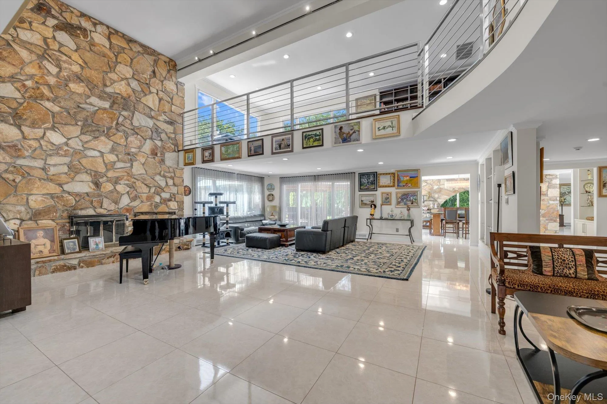 Living Room fireplace and two story ceiling with recessed lighting Living Room fireplace and two story ceiling with recessed lighting